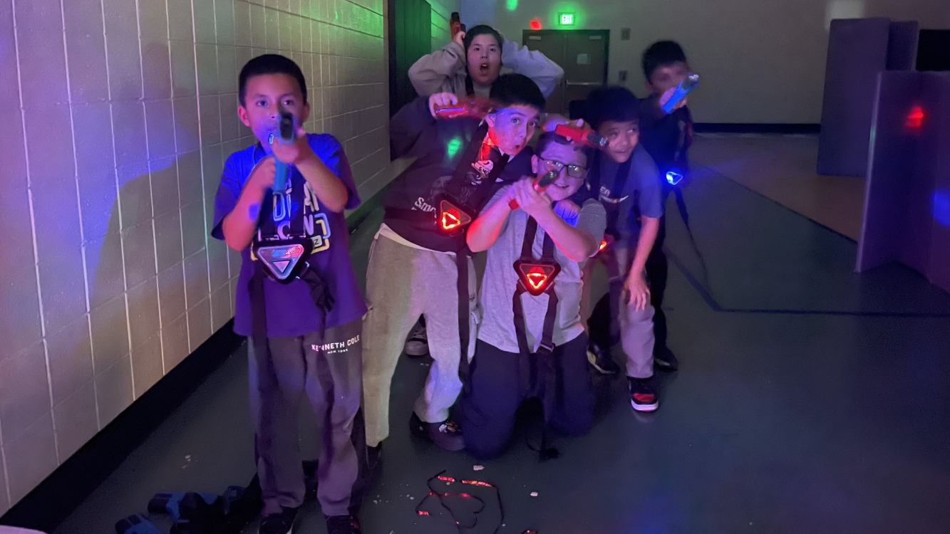 6 teens playing laser tag