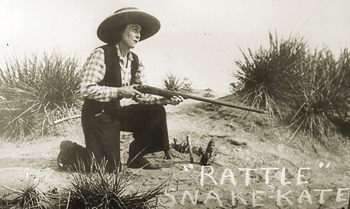 old photo of woman holding rifle and wearing a cowboy hat with words Rattlesnake Kate