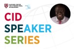 Graphic for the Harvard Center for International Development (CID) Speaker Series, featuring the Harvard shield logo and “Road to GEM” branding. The words “CID Speaker Series” appear in large, colorful text across the image. On the right, there