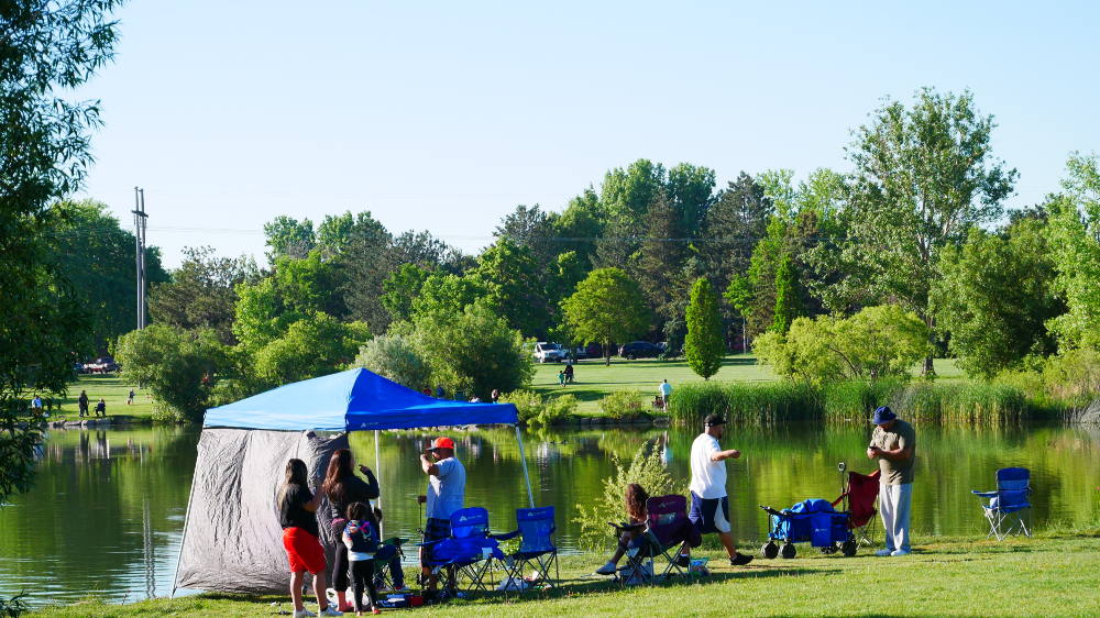 Families set up around the lake for the annual fishing derby.