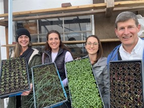 Grow Ogden farm volunteers preparing seeds for planting.