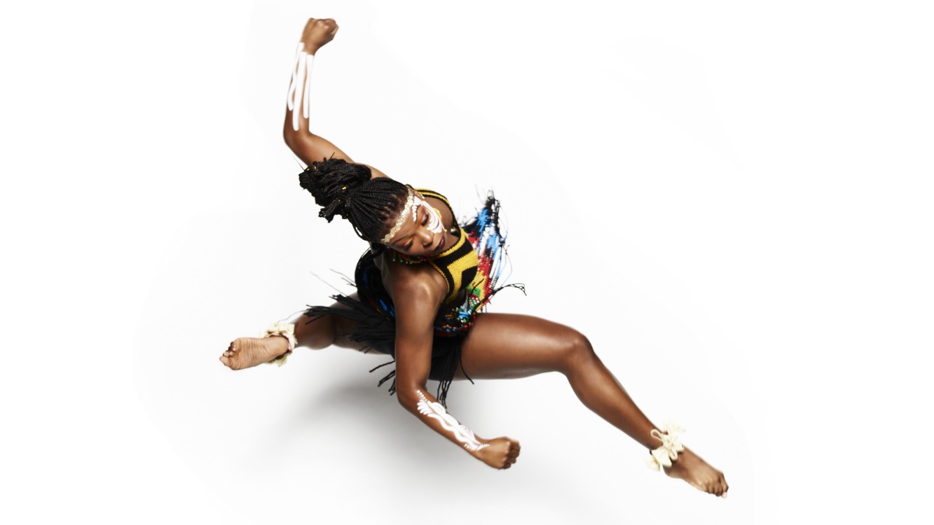 Dancer in African dress leaps