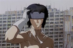 Animated film still of a cyborg with her eyes covered, in front of a derelict cement building.