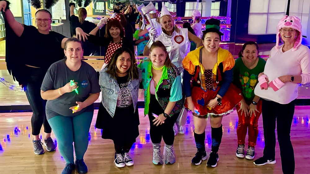 Adults dress in costume during the Zombie Zumba fitness class