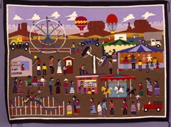 A quilt featuring a scene from a carnival including rides, food stands, games, and hot air balloons. A quilt featuring a scene from a carnival including rides, food stands, games, and hot air balloons.