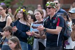 Guests with flower crowns enjoying the summer solstice event.