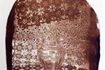 detail of a photographic image exposed on a clay surface, by Corinne Planche