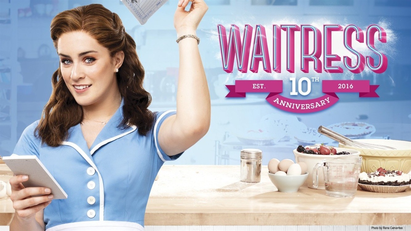 Waitress facing camera holding order sheet with text Waitress 10 Years