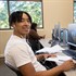 Student using computer in library Student using computer in library